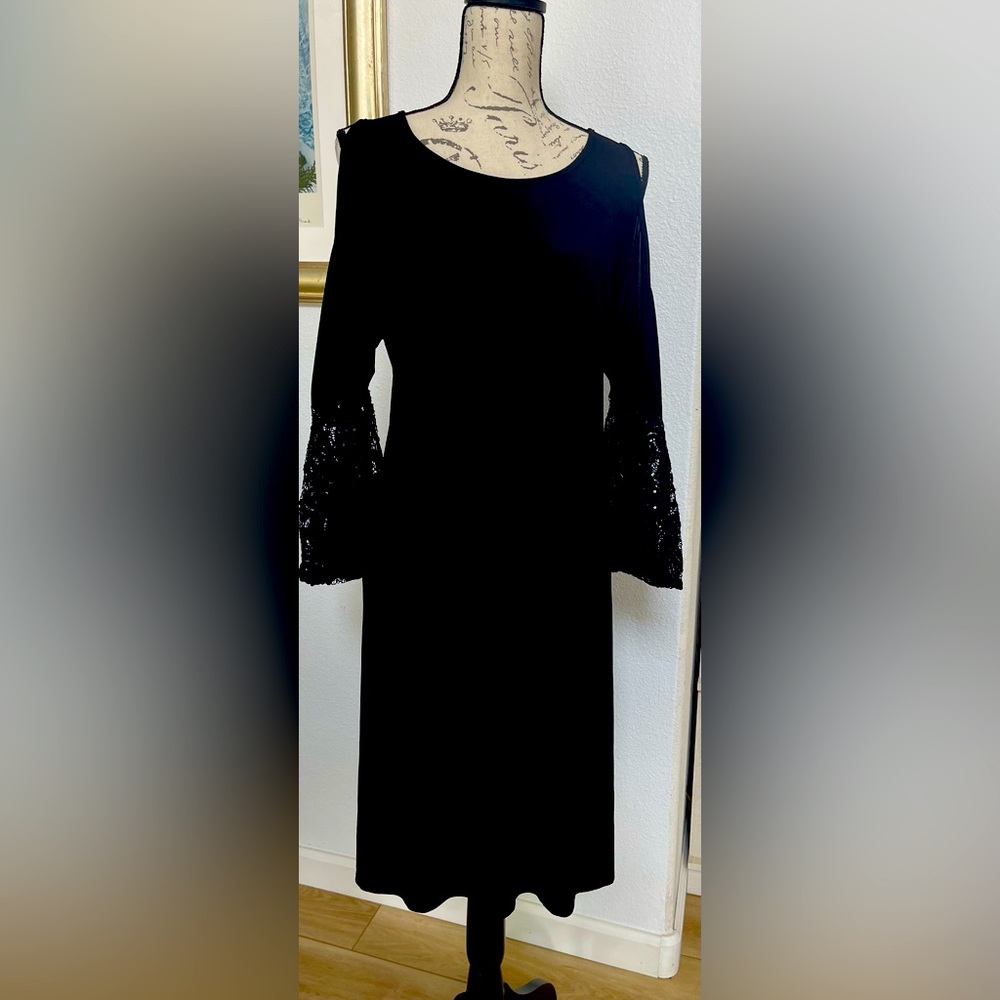 R & M Richard’s from Macys black cocktail dress, knee length.
